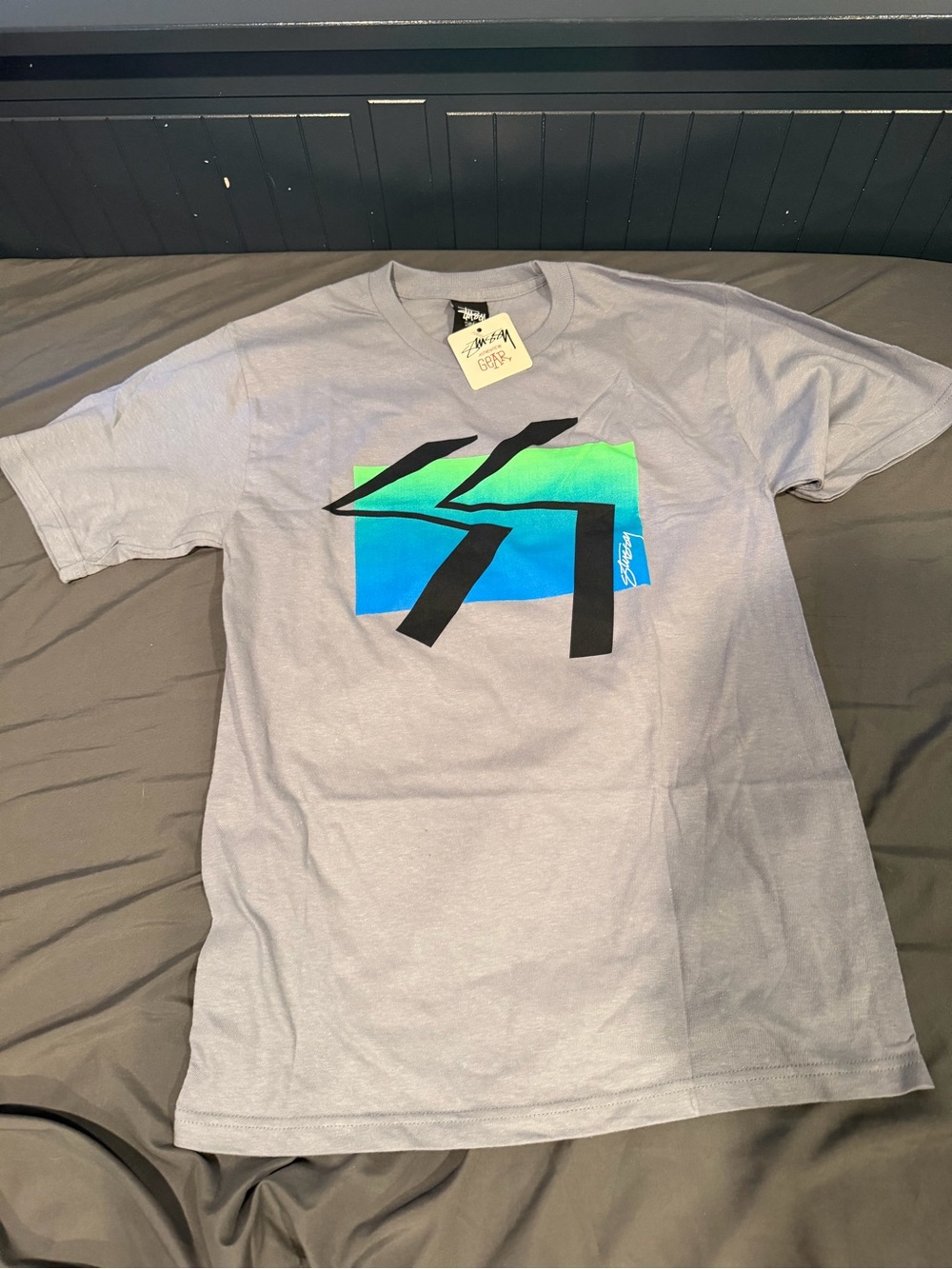 Stussy Gray Tee with Blue-Green Gradient and Black Graphic